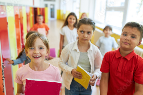 Kids standing near lockers in hallway at school