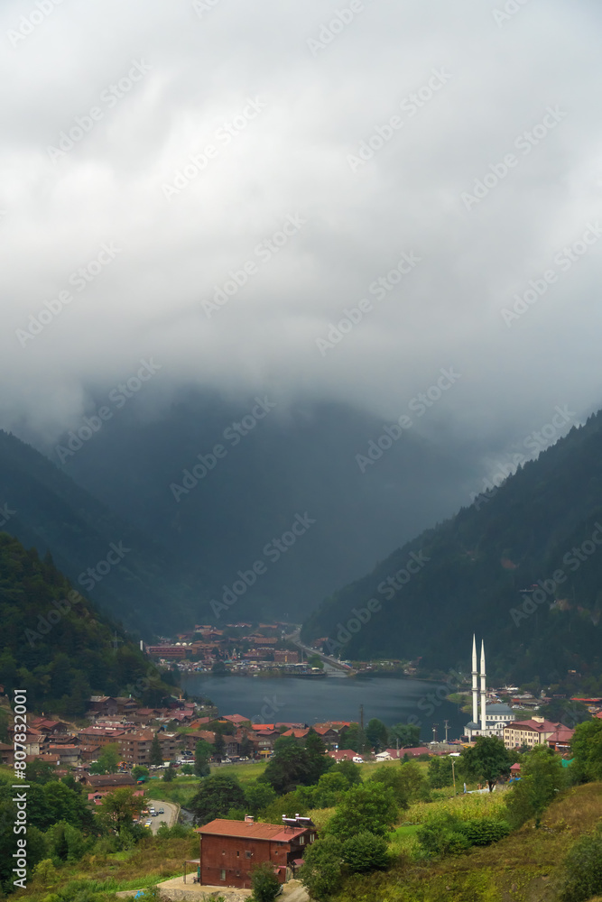 Beautiful view of Lake Uzungol and the surrounding area from the height of the mountains. One of the most beautiful tourist spots in Turkey. A popular summer vacation spot for locals and tourists.