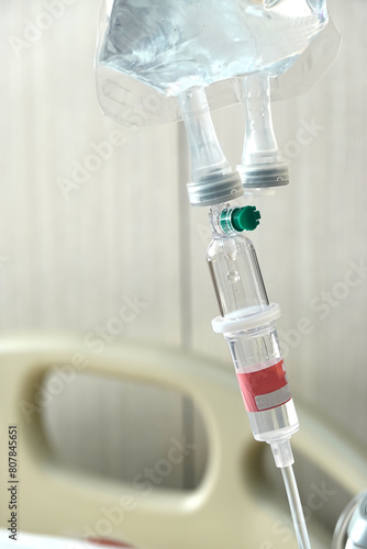 Intravenous drip of medicine hanging in room patient at the hospital.