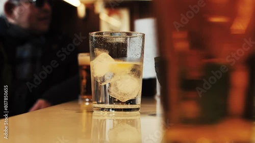 Person having a drink in a bar-Soda-Beer photo