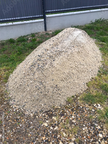 A pile of construction material at the building, White gravel for construction works. High quality photo