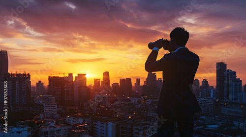 Silhouette of a Businessman Scanning Urban Horizon with Binoculars
