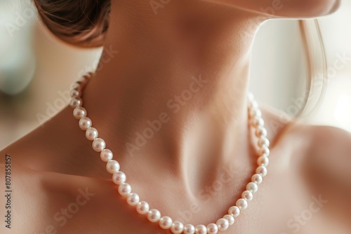 Pearl necklace on woman's neck