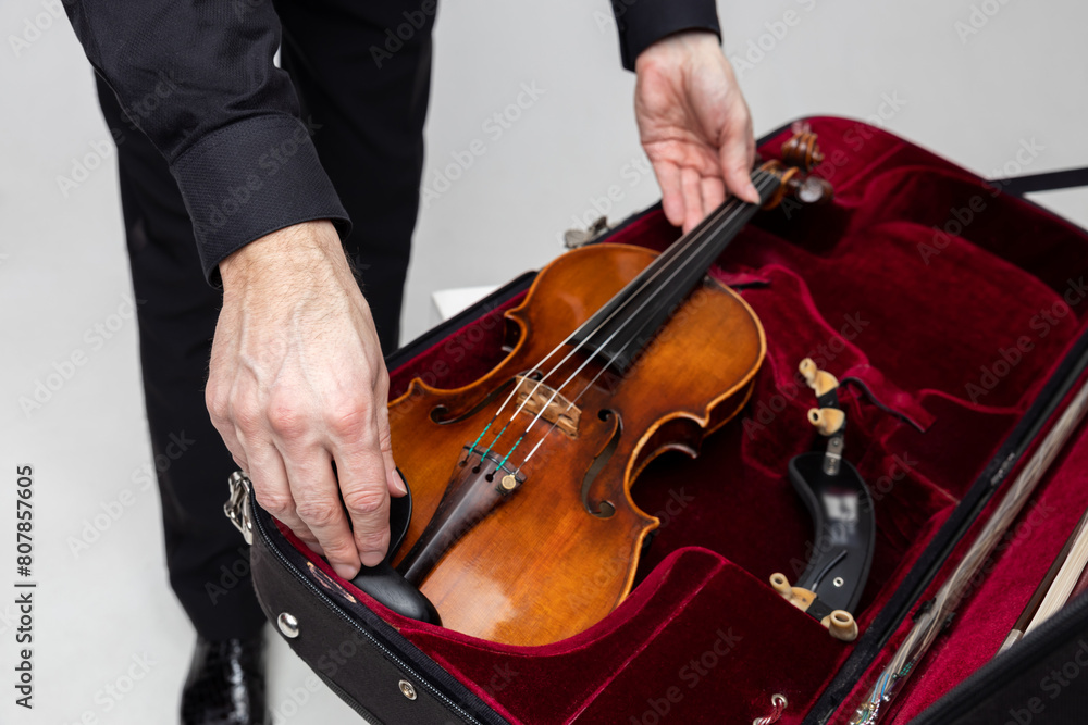 Unrecognizable violist man with instrument in case Unrecognizable violist man with instrument in case
