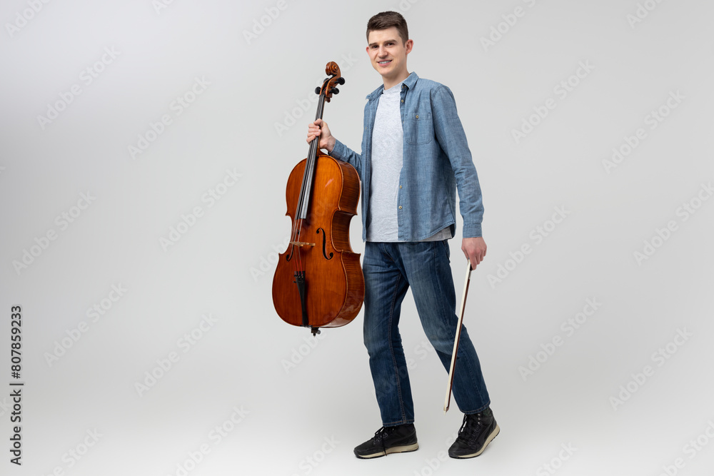 Handsome man musician playing cello on concert Handsome man musician playing cello on concert
