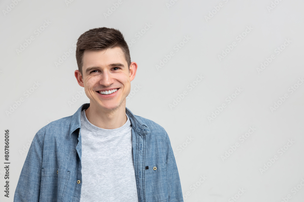 Young smiling happy handsome man wearing casual shirt