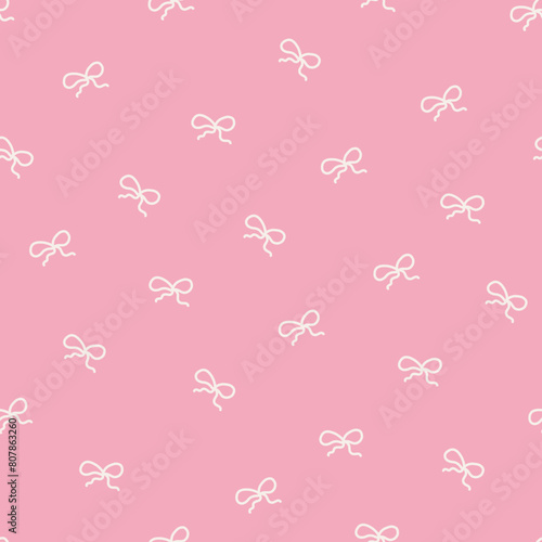 Tiny coquette bows on a pink background - seamless pattern design