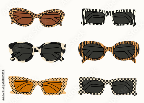 A set of sunglasses with an animalistic pattern. Summer sunglasses, fashionable eyeglass frames. Various shapes and styles. Hand drawn flat style. Women's beach accessories in a modern style.