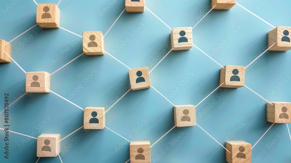 Group of wooden people figures standing on a vibrant blue background, each figure varying in size and shape Group of wooden people figures standing on a vibrant blue background, each figure varying in size and shape