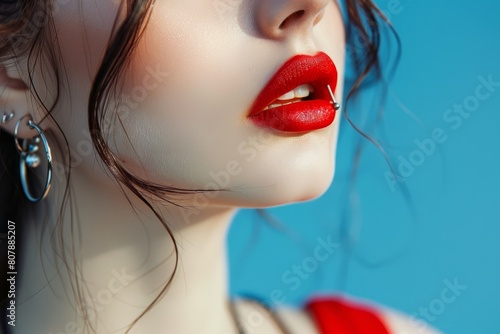 Close-Up of Woman's Face with Bold Red Lips and Nose Piercing, Beauty and Fashion Concept