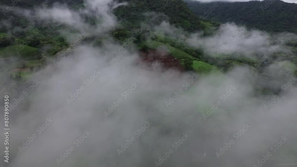4k high-angle Drone flies through the rainy season fog Seeing green forest mountains mountain farmland mountains in the rainy season, 4k high-angle Drone flies through the rainy season fog Seeing green forest mountains mountain farmland mountains in the rainy season,