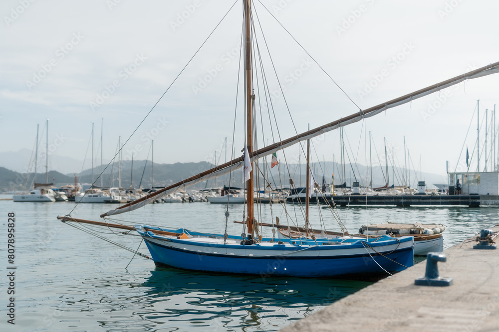 Tranquil Sailing: La Spezia Harbor with Majestic Mountain Backdrop Tranquil Sailing: La Spezia Harbor with Majestic Mountain Backdrop