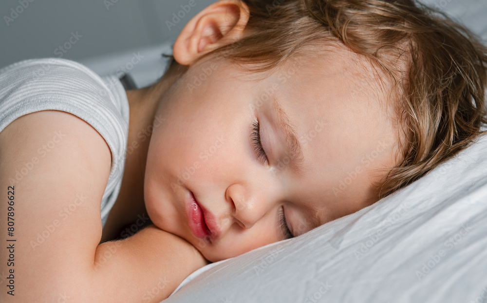 Cute small baby sleeping on the blanket, close up Cute small baby sleeping on the blanket, close up