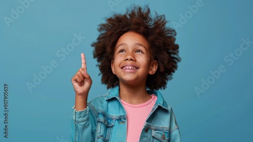 Happy Child Pointing Upwards photo