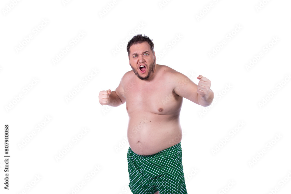 Fototapeta premium Funny fat man makes faces on a white background. Fun and joy.