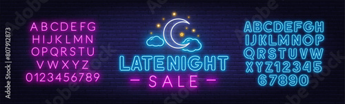 Late Night Sale Neon Sign on brick wall background.