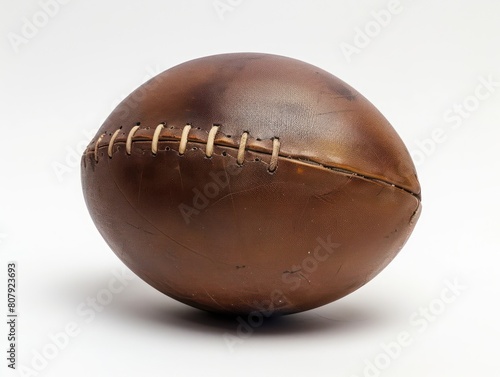 old brown leather american football ball with white background 