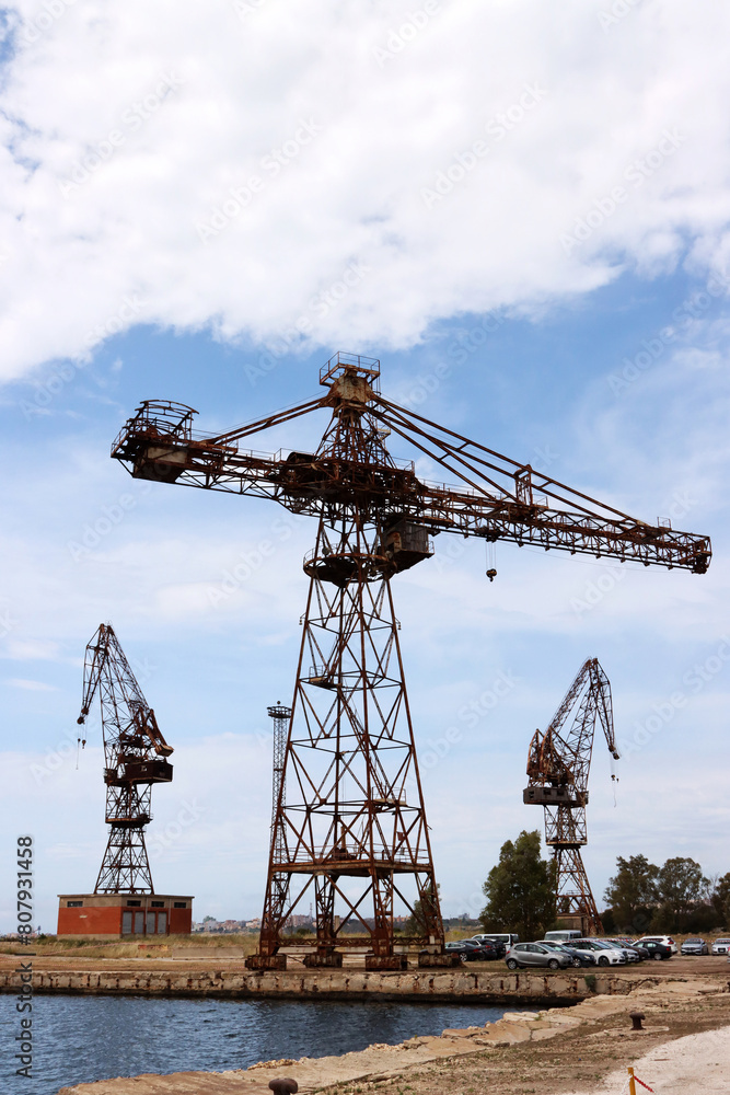 Old abandoned shipyard crane. Column crane Old abandoned shipyard crane. Column crane