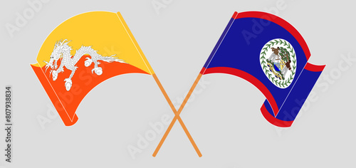 Crossed and waving flags of Bhutan and Belize
