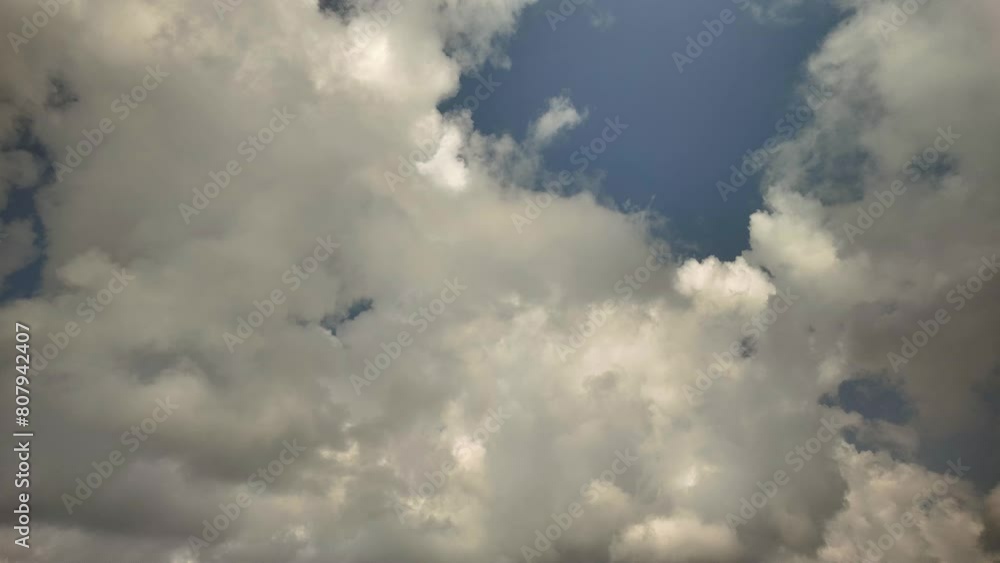 Summertime clouds against a blue sky Summertime clouds against a blue sky