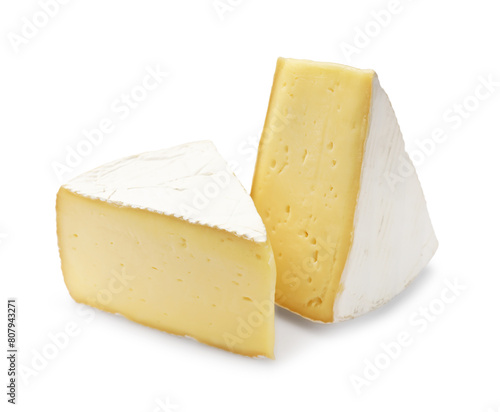 Pieces of tasty camembert cheese isolated on white