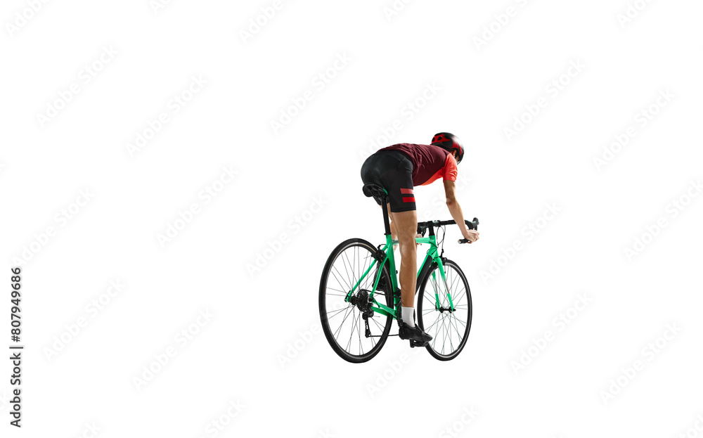 Back view. Young man, cyclist in sportswear and helmet riding bicycle, training against transparent background. Concept of sport, action, competition, power and endurance, health marathon. Back view. Young man, cyclist in sportswear and helmet riding bicycle, training against transparent background. Concept of sport, action, competition, power and endurance, health marathon.