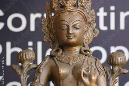 Photography Bronze Asian figurine. Portrait photo.