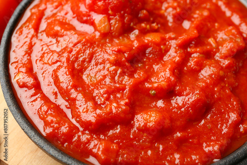 Homemade tomato sauce in bowl on table, closeup © New Africa