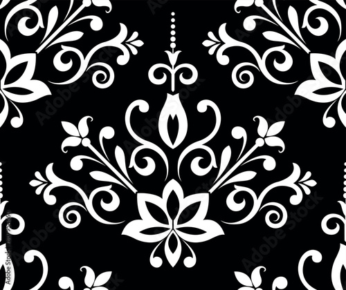 Wallpaper in the style of Baroque. Seamless vector background. White and black floral ornament. Graphic pattern for fabric, wallpaper, packaging. Ornate Damask flower ornament.