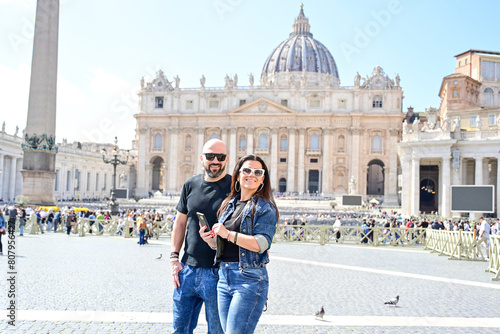 Photography Happy smiling beautiful  Tourists  couple traveling at Rome, Italy, poses and making photos  in front of   Vatican City  at, Rome, Italy