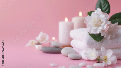 Spa treatment background. Towels, candles, chamomile, massage stones. Spa Massage, oriental therapy, wellbeing and meditation concept.