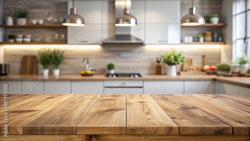 Empty wooden table and blurred kitchen interior background.