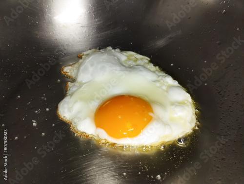 fried egg in a sunny side up in a frying pan