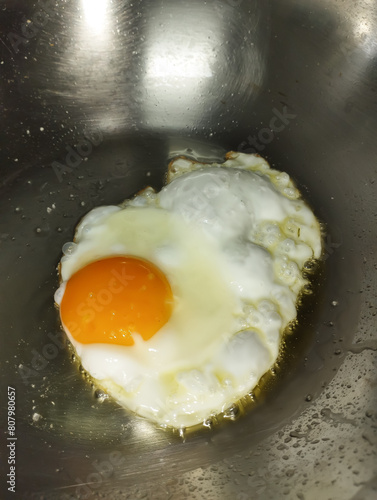 fried egg in a sunny side up in a frying pan