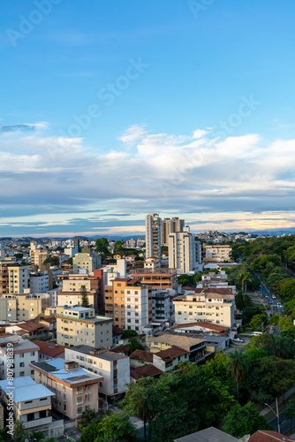 Residential buildings seen from above in the city of Belo Horizonte. Beautiful blue sky with clouds. Vehicle traffic. Vertical.