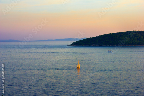 Sunset on the Adriatic Sea. Seascape with a sailing ship.