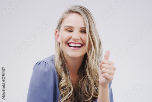 Wallpaper Mural Studio, excited and woman in portrait with thumbs up for agreement, deal and yes with backdrop. Approval, smile and happy girl with good hand gesture, feedback or support and sign by white background Torontodigital.ca