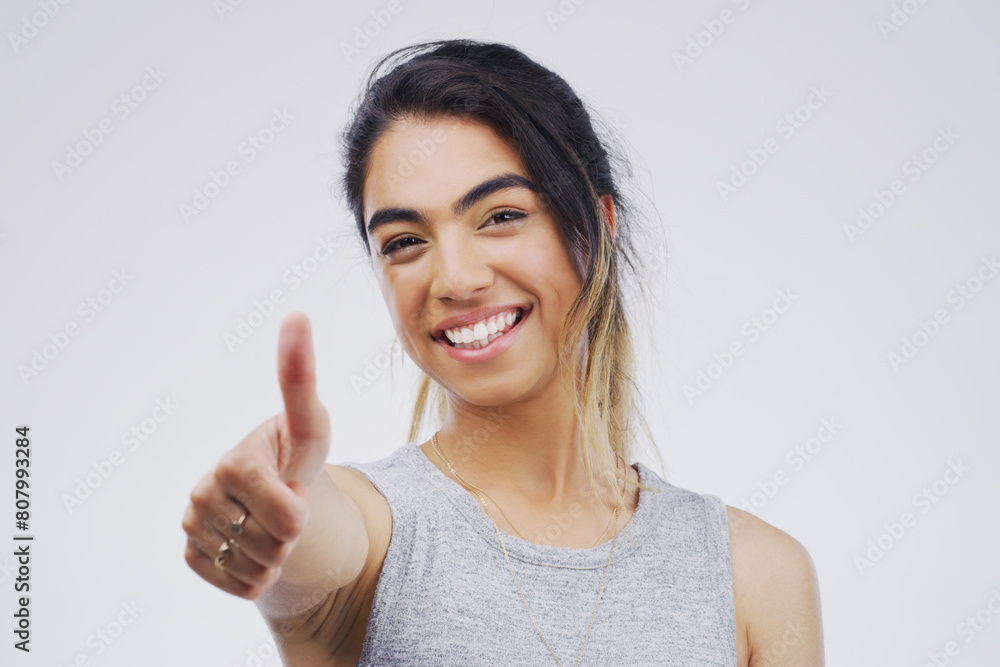 Studio, portrait and African woman with thumbs up for approval, deal and yes with mockup. Agreement, smile and happy girl with good hand gesture, satisfaction expression or sign by white background Studio, portrait and African woman with thumbs up for approval, deal and yes with mockup. Agreement, smile and happy girl with good hand gesture, satisfaction expression or sign by white background