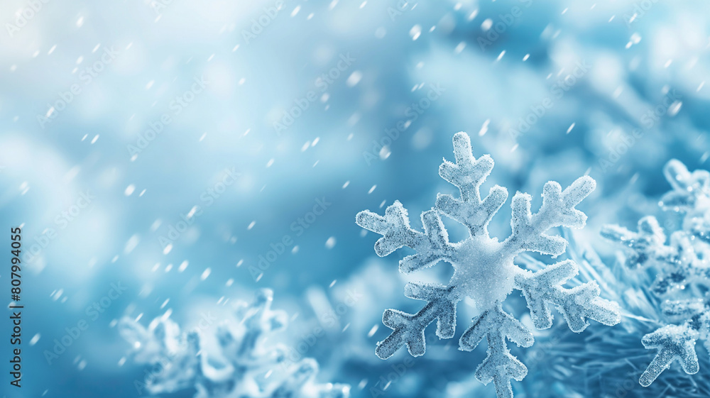 A snowy landscape with three snowflakes on the ground