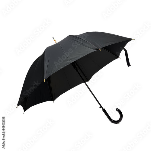 A black umbrella with a gold handle
