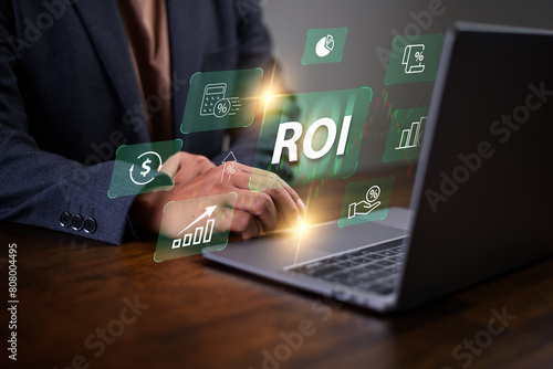 Return on investment (ROI) , Businessman using a sofware to analysis investment to get high return.