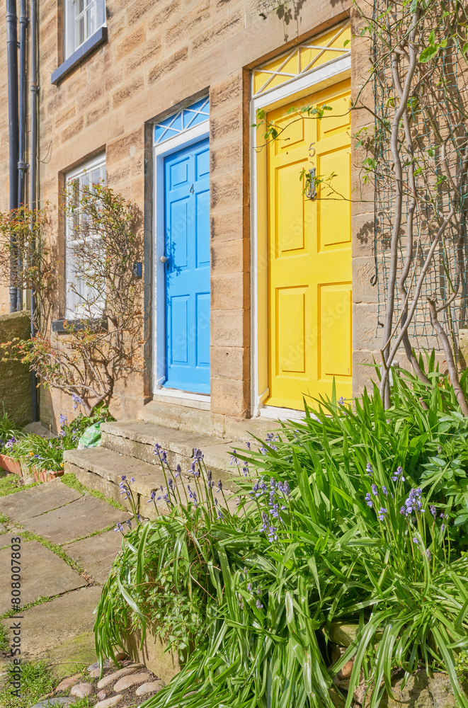 Fototapeta premium Two front doors with vontratsing colors blue and yellow