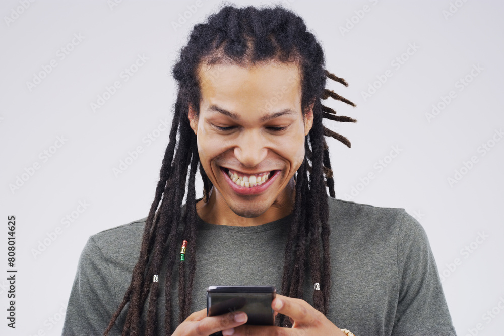 Man, phone and excited for news in studio, victory notification and lottery success. Happy male person, investment profit and excited for bonus on white background, promotion email and discount deal Man, phone and excited for news in studio, victory notification and lottery success. Happy male person, investment profit and excited for bonus on white background, promotion email and discount deal