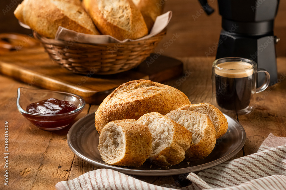 Naklejka premium French bread in the basket with butter and rustic background