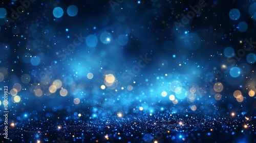 Abstract blue bokeh lights background with glowing particles and stars on dark night © tanapat