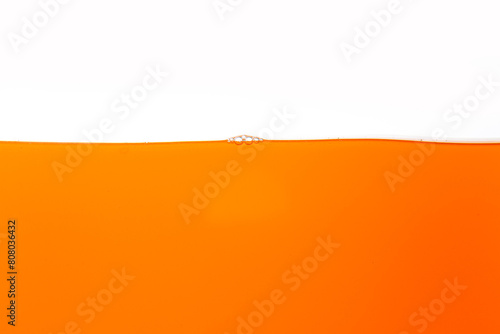 Orange juice texture, close-up, macro, isolated white background,Close up bright orange juice texture for health and nature waves