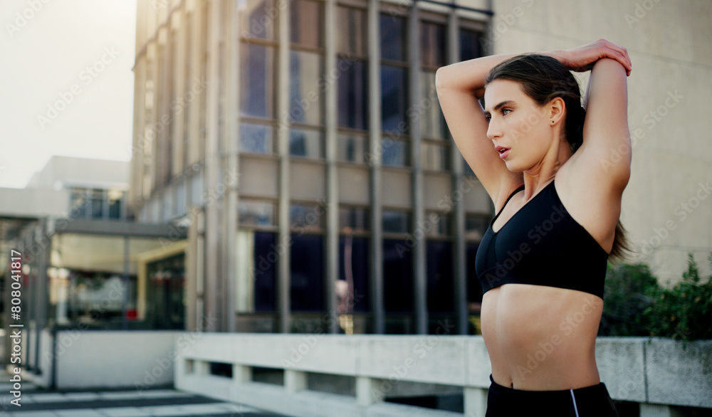 Woman, stretching and building in city for exercise, fitness and breathing in sportswear in day. Warm up, arms and workout in urban town for cardio, goals and challenge for wellness in new york