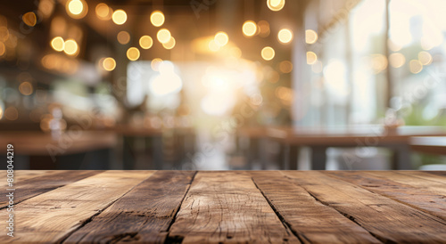 wood table on blur of cafe  coffee shop  bar  background - can used for display or montage your products