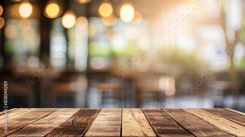 wood table on blur of cafe, coffee shop, bar, background - can used for display or montage your products photo