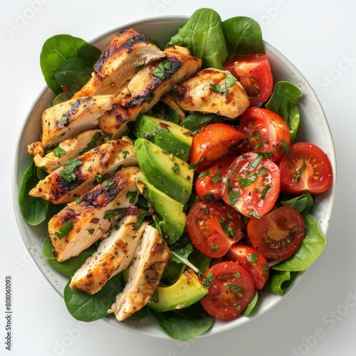Grilled chicken breast with avocado, tomato and spinach salad